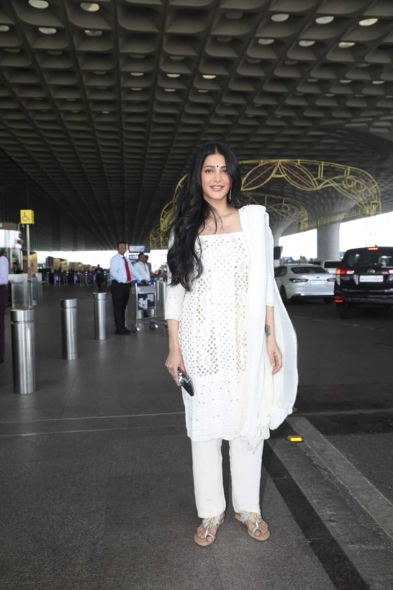 <p>Shruti Haasan was seen in a white churidar as she was spotted at the Mumbai airport on her way out of the city</p>